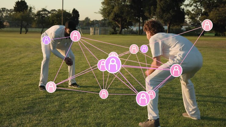 Two male players tapping ball, swinging mallets playing lawn game, AR network pulsing toward ball