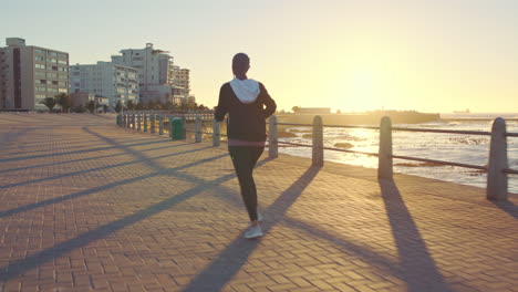 Woman-runner,-islam-and-beach-with-hijab-in-summer