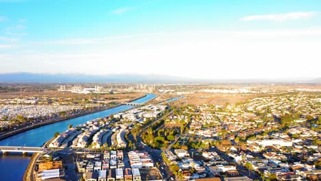 Panning-drone-shot-of-the-San-Gabriel-River-over-to-the-Seal-Beach-Pier