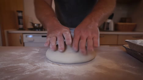 Person Kneading Dough for Baking