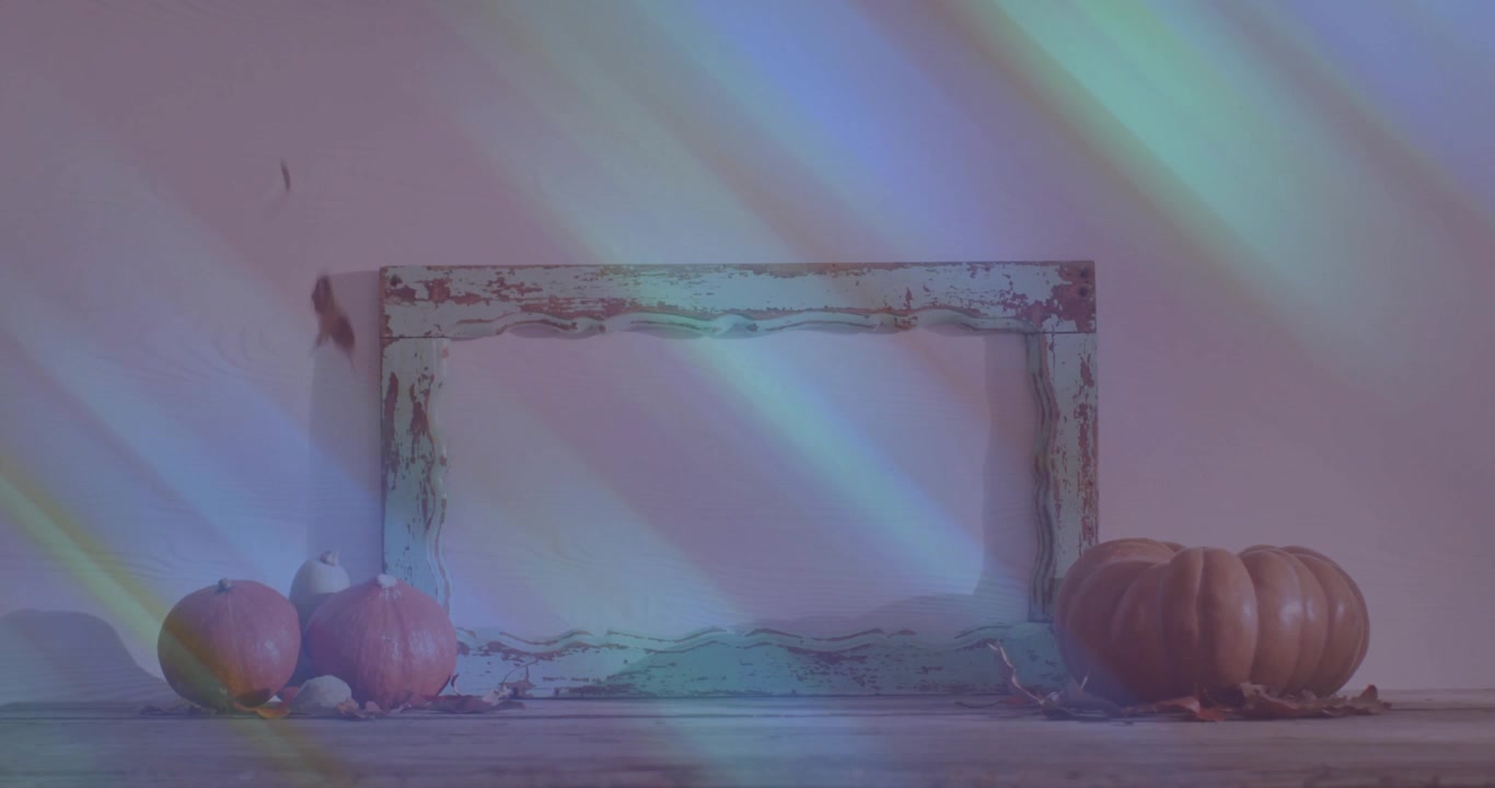 Exhibición otoñal con calabazas, marco rústico y efecto de luz de arcoíris