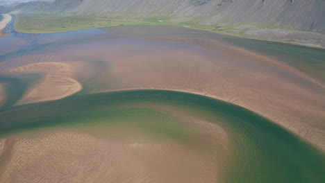 beautiful rotating shot of raudisandur beach in westfjords of iceland - aerial 4k