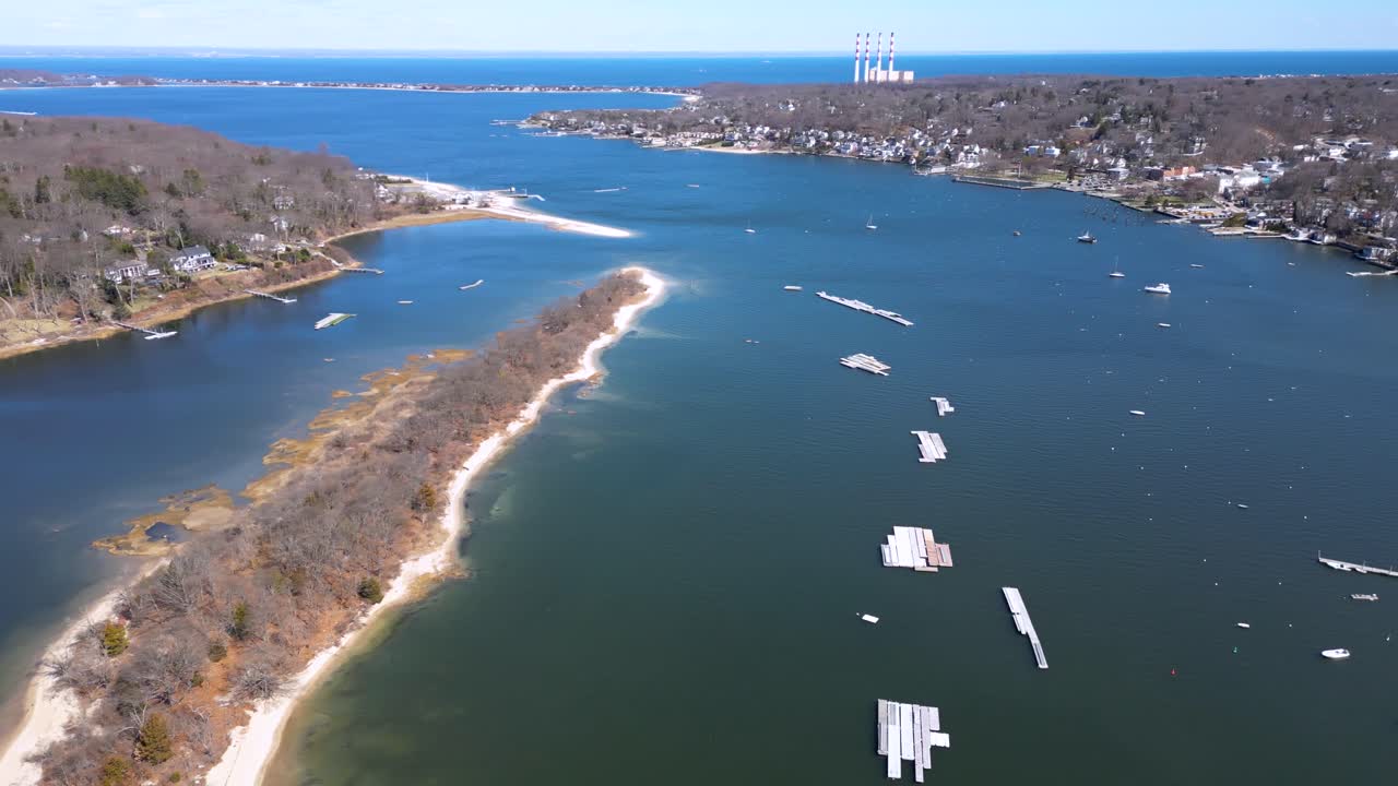 Drone footage of Bird Island between Northport Bay and Centerport Harbor, showing coastal homes, marinas, and the shoreline of Long Island’s North Shore on a peaceful sunny day.
