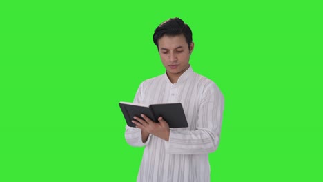 Indian-man-reading-a-book-Green-screen