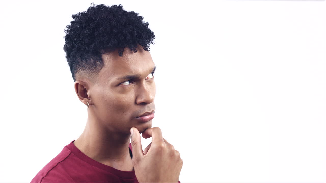 Man, confused and thinking of ideas in studio