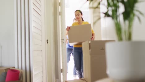 Happy-caucasian-couple-in-love-moves-into-an-apartment