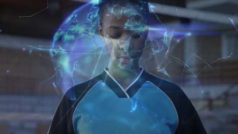 teenage female athlete interacting with holographic globe and data in gym technology showcase