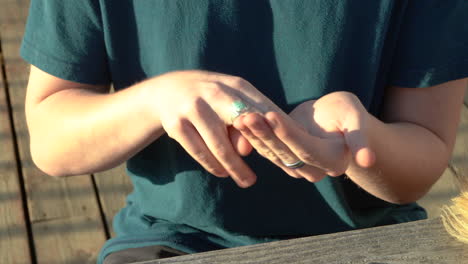 Teenage-boys-hands-are-seen,-gesturing-in-sign-language