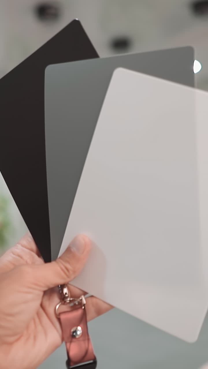 Professional cameraman adjusts contemporary equipment with special tools before shooting in light palace hallway closeup. Photographer at work