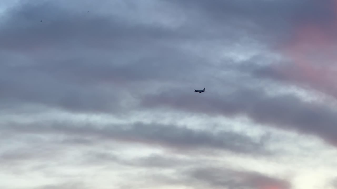 Airplane fly in the sky, beautiful colour evening before sunset
