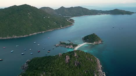 aerial establish of nang yuan island, showcasing its turquoise waters and lush green hills against the open ocean.