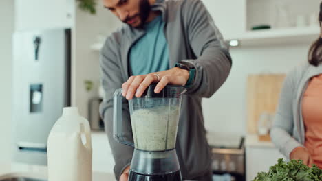 Making a healthy smoothie in the kitchen