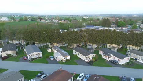 A-drone-glides-over-a-tranquil-suburban-mobile-home-area-as-the-day-slowly-fades-into-twilight