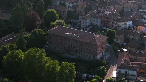aerial view of castell'arquato, a picturesque medieval village in emilia romagna, italy, showcasing palazzo del podesta amidst lush greenery