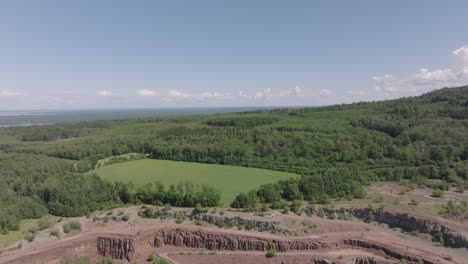 Lush-Forestland-Near-Large-Quarry-Of-Kinnekulle-Stenbrott-In-Hallekis,-Sweden