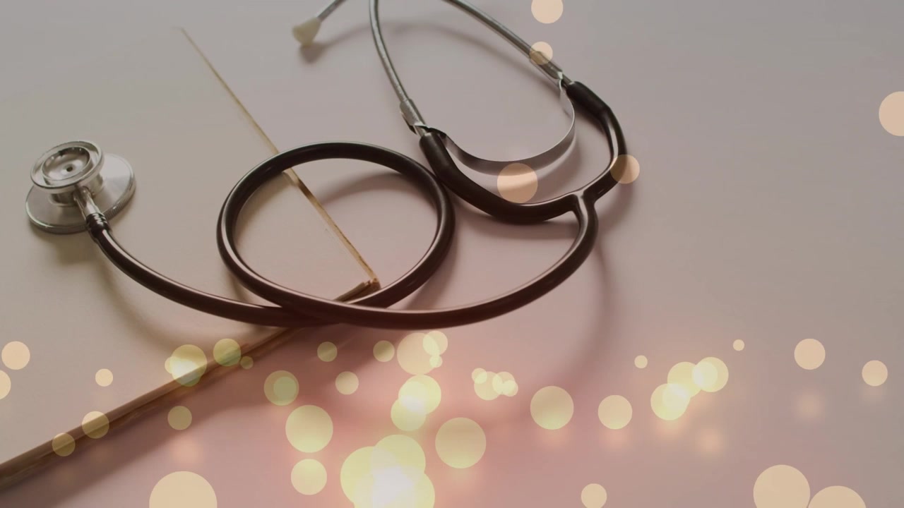 Medical Stethoscope Resting on a Notebook with Bokeh Light Effects