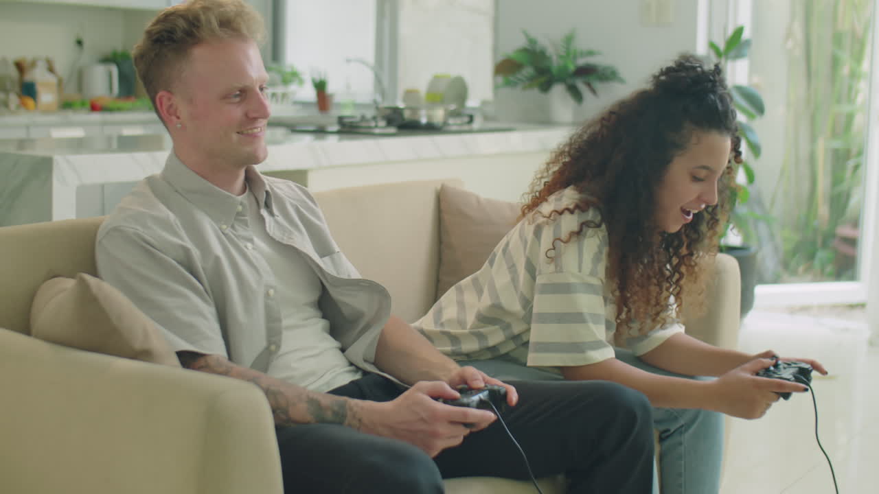 Gen Z Couple Enjoying Playing Console at Home