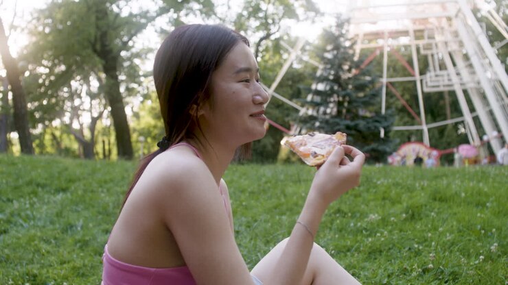 Happy woman on a picnic at the park