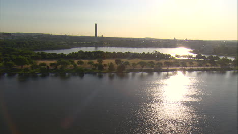 washington dc aerial flying over the potomac and jefferson memorial at sunset