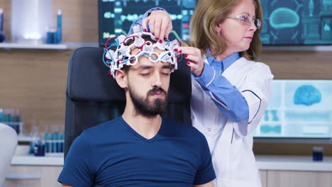 Male-patient-falling-asleep-while-female-doctor