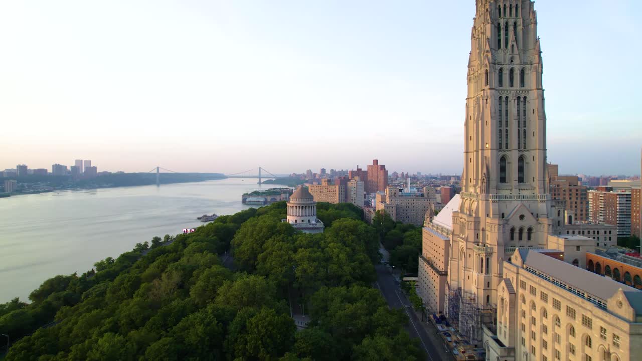 Long drone clip of a summer evening in NYC, Riverside Cathedral, Grant's Tomb, Hudson River and George Washington Bridge