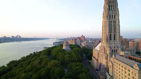 long drone clip of a summer evening in nyc, riverside cathedral, grant's tomb, hudson river and george washington bridge