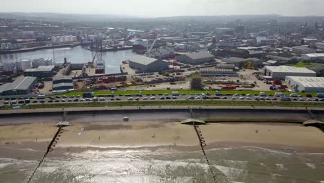 drone passing over aberdeen beach with waves