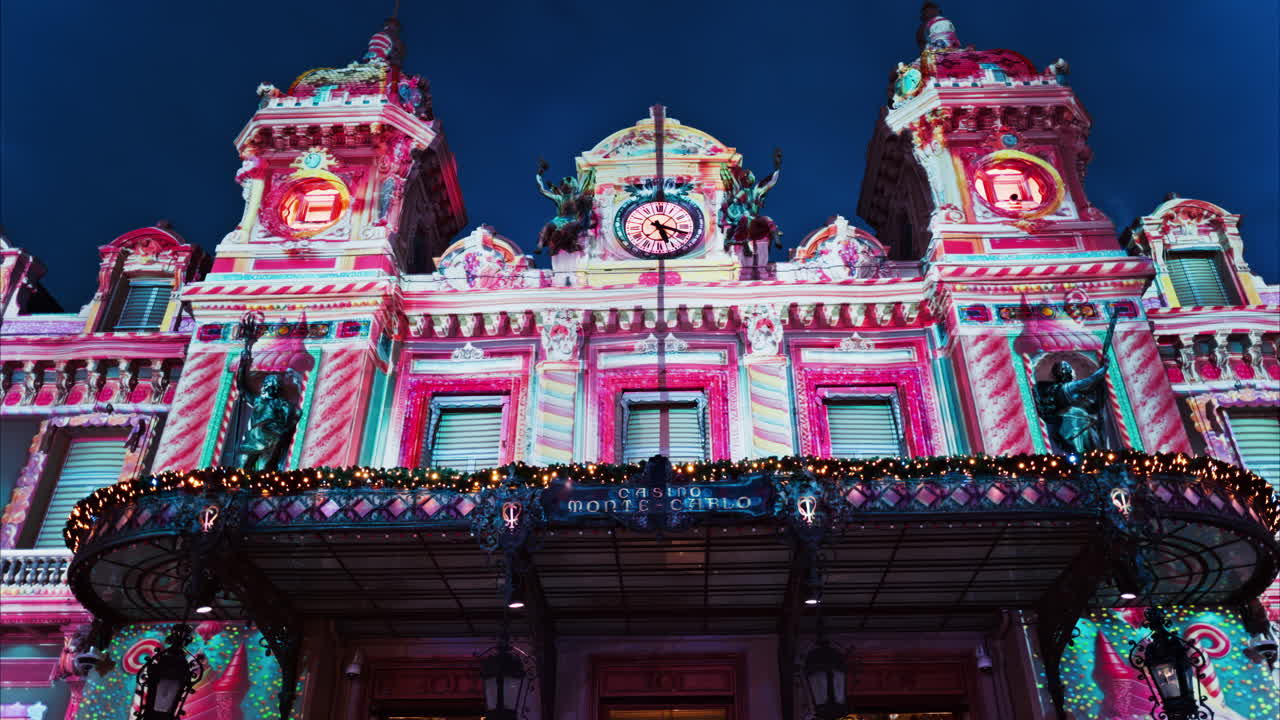 Monte Carlo, Monaco - December 14, 2024: Front view of the Monte Carlo Casino decorated for Christmas in the evening