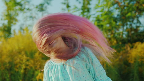 cool girl playing with her pink long hair