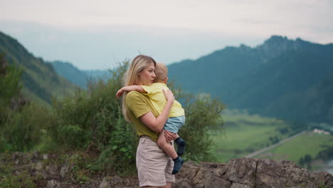 Positive-mother-taps-and-strokes-boy-back-at-highland