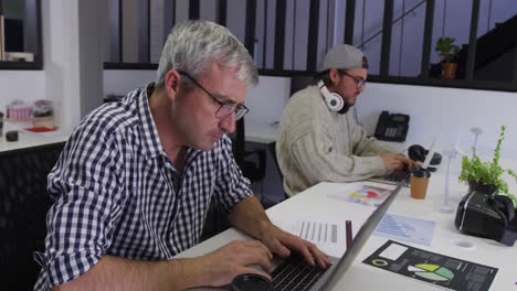 two caucasian men working in a creative office