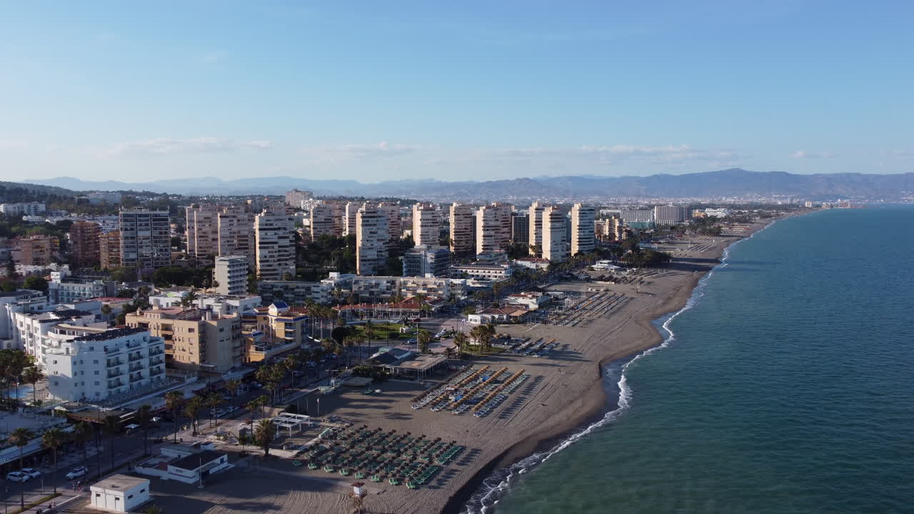 Aerial Pullback Torremolinos Beach Ocean View Buildings Golden Hour