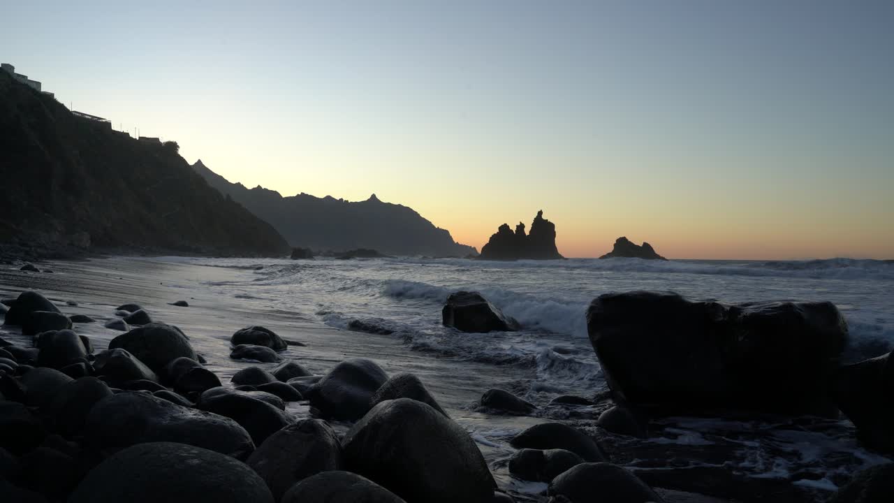 Waves wash volcanic stones on the Playa de Benijo beach in Tenefife