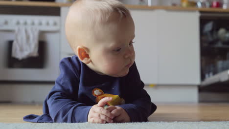 Baby-girl-making-efforts-to-crawl-on-the-floor-at-home