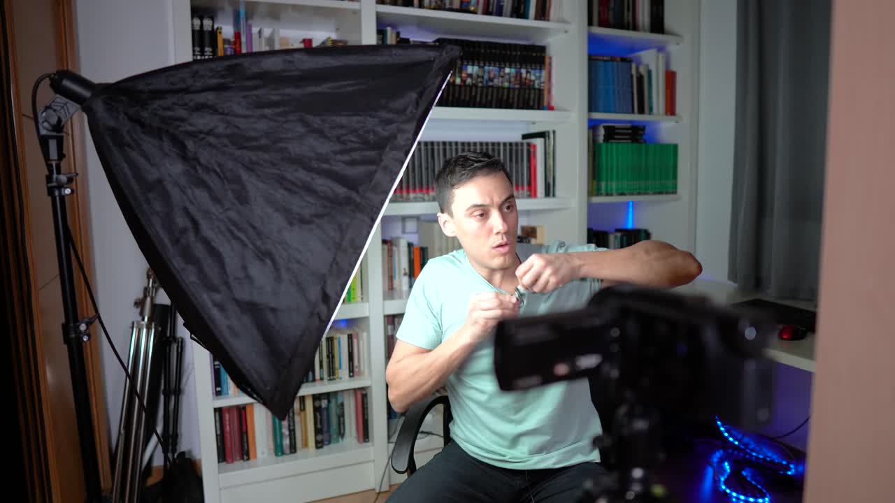 Man Preparing and Filming Video in Home Studio