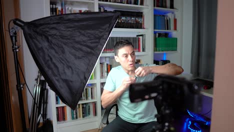 man preparing and filming video in home studio
