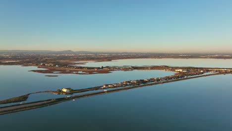 Aerial-view:-Etang-de-Vic-bathed-in-sunset.