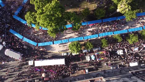 drone straight down shot of many human on street marching for human rights on earth - lgbt pride parade in buenos aires in plaza de mayo during sunny day