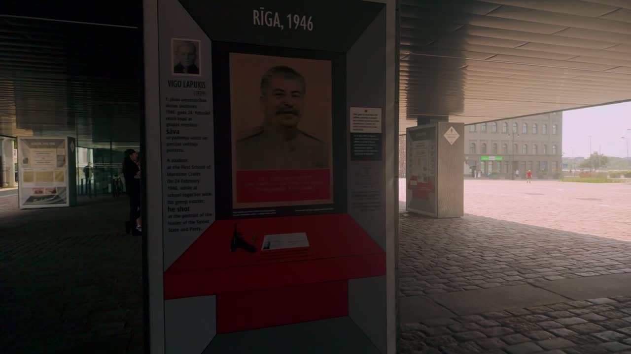 Dark columns with exhibits explaining Latvia's history during Soviet occupation, showcasing pivotal events and figures at the Latvian Museum of Occupation in Riga, Latvia