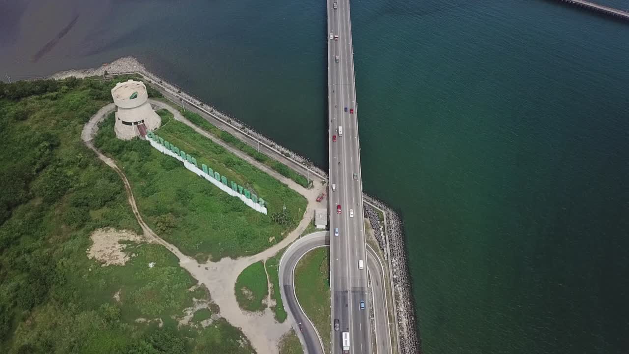 Cebu South Coastal Road Traffic, Birds Eye Aerial View. SRP Tower Landmark Vehicles on Seaside Highway and Sea Bridge