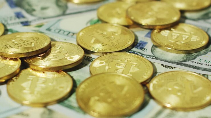 Physical coins of cryptocurrency and bills