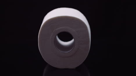 toilet paper isolated on black background rotating 1