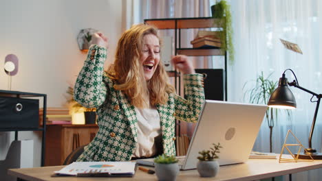 money cash dollar rain falling on businesswoman with laptop celebrating success win lottery jackpot