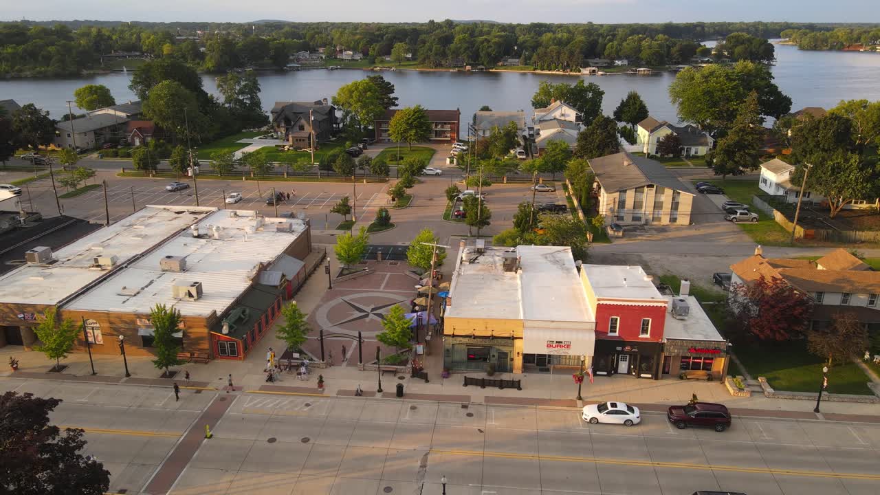 Aerial View of a Quaint Town by the River at Sunset
