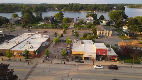 aerial view of a quaint town by the river at sunset