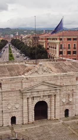 historic porta nuova in verona with the european flag waving above corso porta nuova.