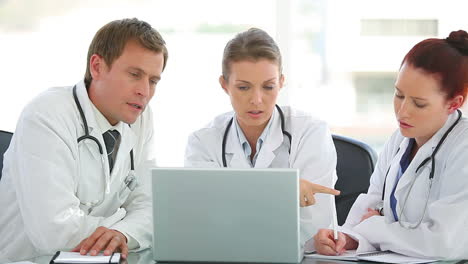 Three-medical-doctors-watching-the-laptop