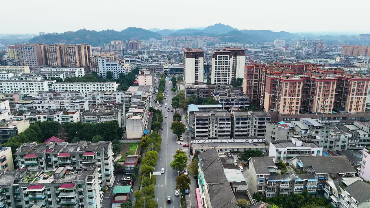 Aerial view of Chengdu's Xinjin County showcases a dense urban cityscape with residential buildings, China