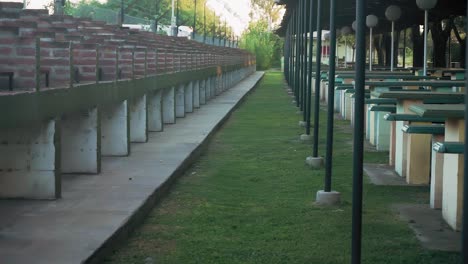 rows of brick barbecues in a park