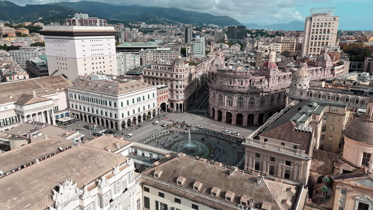 Drone view over Piazza de Ferrari with iconic fountain in historic Genoa, Italy